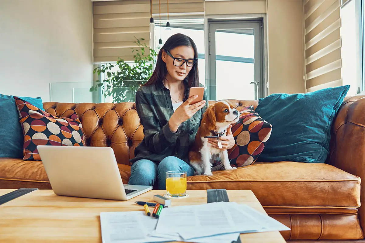 Woman using a veterinary app on her phone