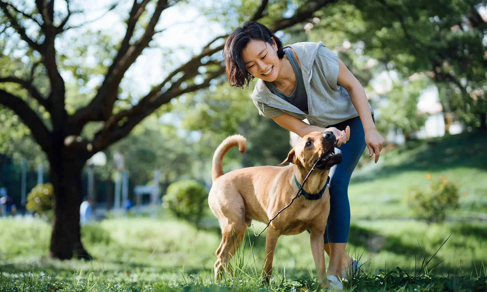 A woman with her dog outside